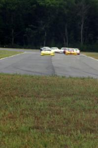 The field comes into turn 4 on the first lap.