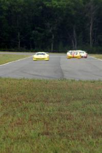 The field comes into turn 4 on the first lap.