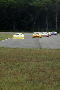 The field comes into turn 4 on the first lap.