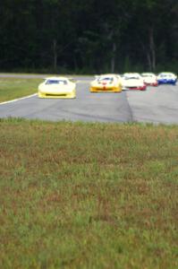 The field comes into turn 4 on the first lap.