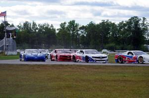 Racing resumes after a very long yellow period.