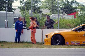 Dale Madsen parks his Ford Mustang after an accident on the re-start