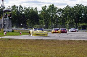 1. Doug Peterson, 2. Tony Ave, 3. Amy Ruman and 4. Simon Gregg, all in Chevy Corvettes.