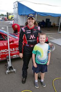 Amy Ruman poses with a young fan