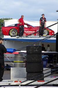 Amy Ruman's Chevy Corvette is loaded into the trailer