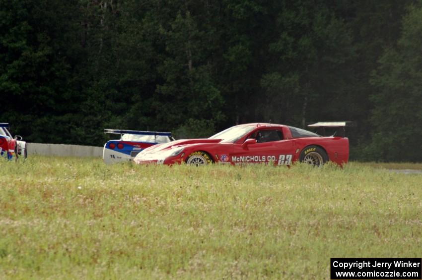 Amy Ruman loops her Chevy Corvette onto the grass between turns four and five