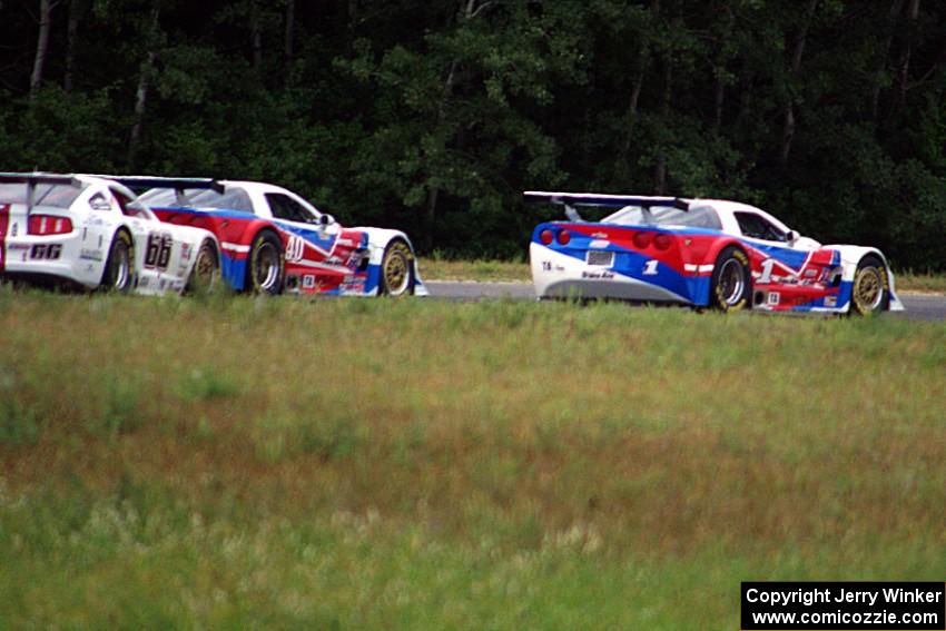 Simon Gregg's and Jed Copham's Chevy Corvettes hold off Cliff Ebben's Ford Mustang