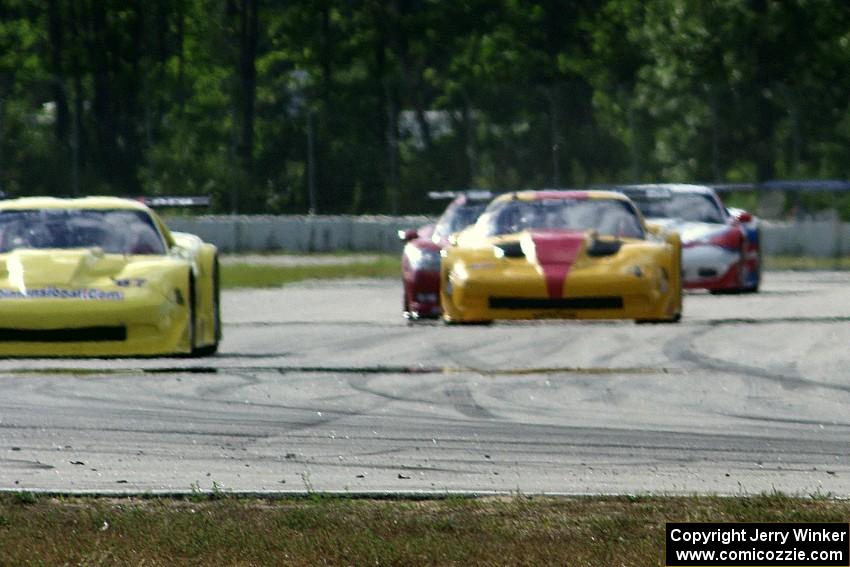 1. Doug Peterson, 2. Tony Ave, 3. Amy Ruman and 4. Simon Gregg, all in Chevy Corvettes.