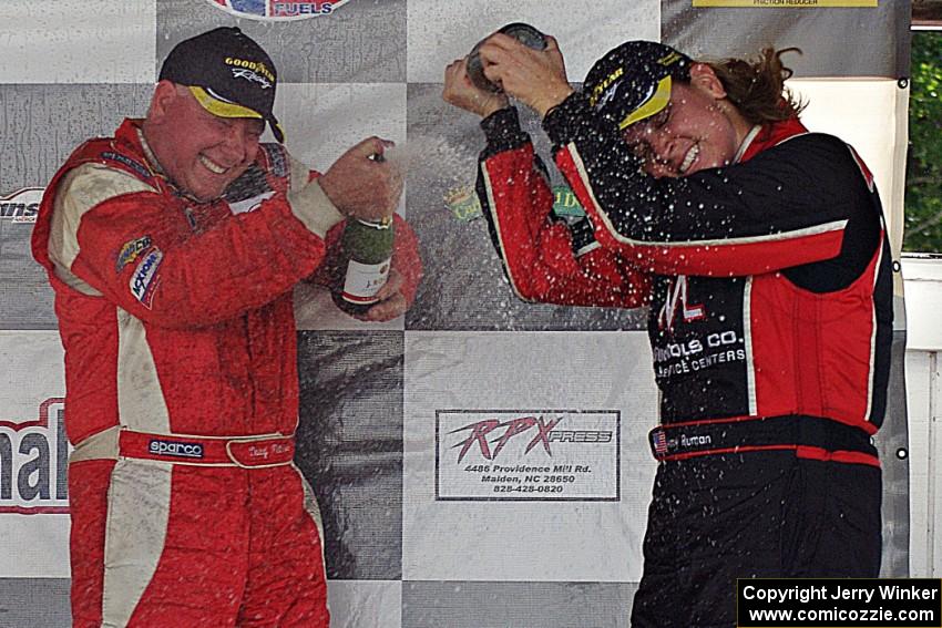 Race winner Doug Peterson sprays Amy Ruman who took the final podium spot