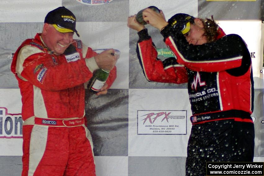 Race winner Doug Peterson sprays Amy Ruman who took the final podium spot