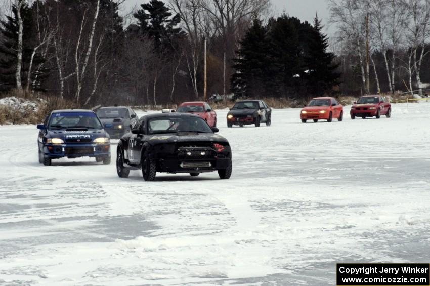 The third portion of the Big Lake Lounge Enduro about to start as cars line up and leave the paddock.