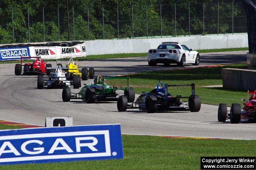 The field enters the kink on the pace lap.