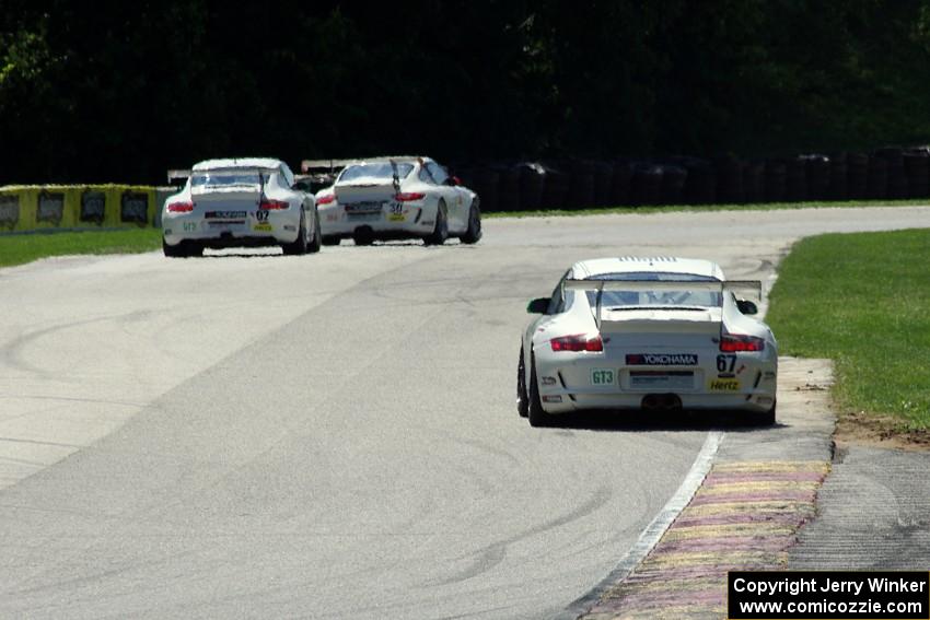 Wayne Ducote (67) chases (30) Angel Benitez, Sr.'s and (02) Wesley Hoaglund's Porsche GT3 Cup cars