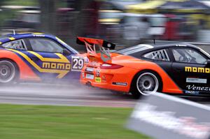 (25) Angel Benitez, Jr.'s and (29) Eduardo Cisneros' Porsche GT3 Cup cars head into turn three