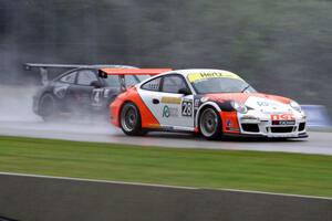 (28) Amadeo Quiros' and (4) Peter Collins' Porsche GT3 Cup cars head into turn three