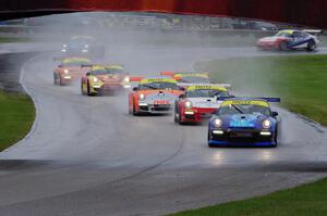 Sloan Urry's Porsche GT3 Cup leads the field into the carousel after the re-start.