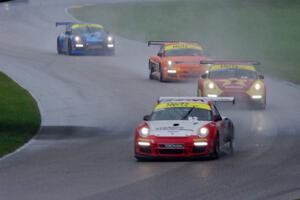 Madison Snow, Brett Sandberg, Colin Thompson and Sloan Urry, all in Porsche GT3 Cup cars, head into the carousel.