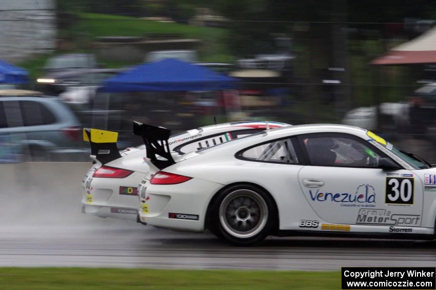 Angel Benitez, Sr.'s Porsche GT3 Cup passes another car going into turn three