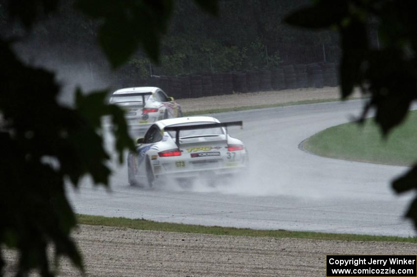 Michael Levitas's and David Williams' Porsche GT3 Cup cars in the carousel