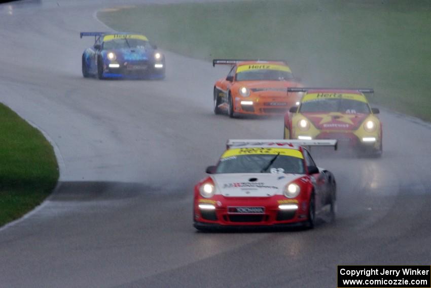 Madison Snow, Brett Sandberg, Colin Thompson and Sloan Urry, all in Porsche GT3 Cup cars, head into the carousel.