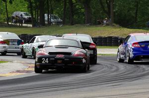 Cory Friedman / Mac McGehee Porsche Boxster at the back of a pack of ST cars