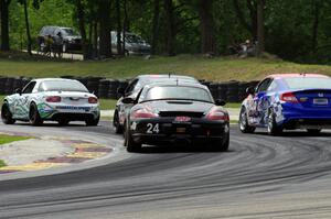 Cory Friedman / Mac McGehee Porsche Boxster at the back of a pack of ST cars