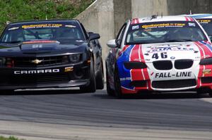 Mark Boden / David Donohue BMW M3 Coupe BMW M3 Coupe passes the Lawson Aschenbach / Eric Curran Camaro GS.R