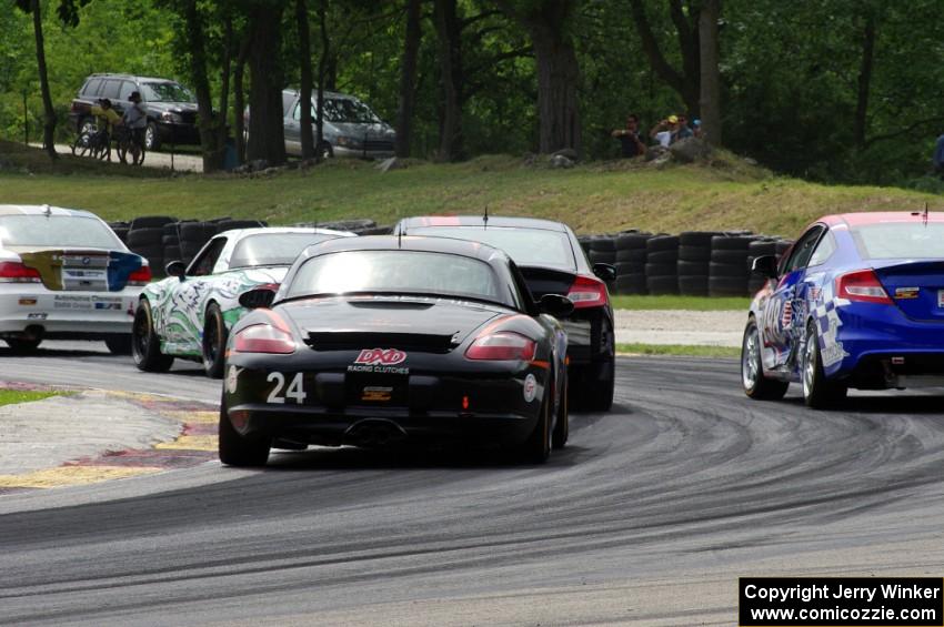 Cory Friedman / Mac McGehee Porsche Boxster at the back of a pack of ST cars