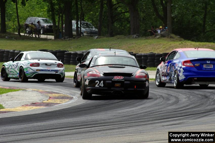 Cory Friedman / Mac McGehee Porsche Boxster at the back of a pack of ST cars