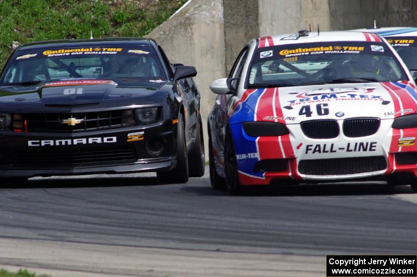 Mark Boden / David Donohue BMW M3 Coupe BMW M3 Coupe passes the Lawson Aschenbach / Eric Curran Camaro GS.R