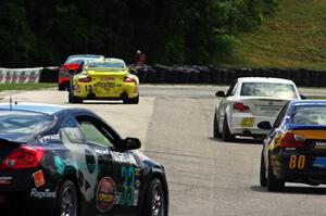 The field keeps its tires warm during a yellow flag