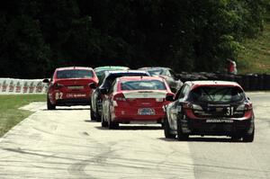 Jayson Clunie / Pierre Kleinubing Mazda Speed 3 trails the lead pack of ST cars into turn 7