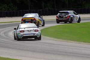 Andrew Carbonell / Rhett O'Doski Mazda MX-5 chases two other ST cars