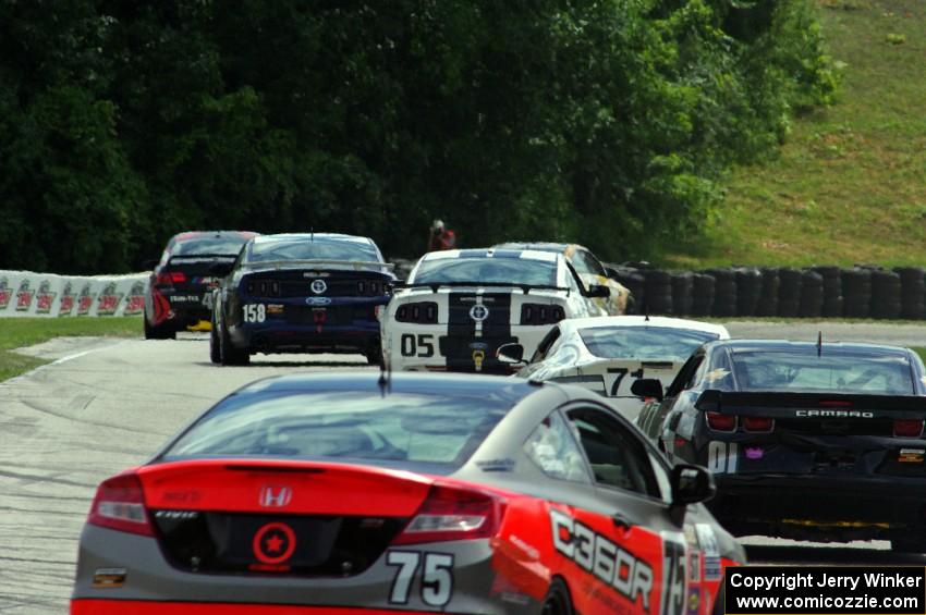 The field keeps its tires warm during a yellow flag