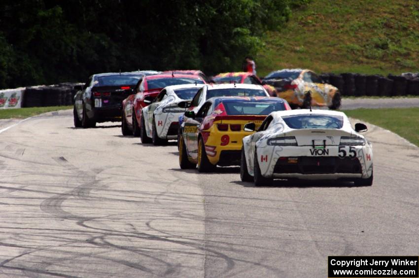 Jade Buford / Scott Maxwell Aston Martin Vantage trails a group of GS cars into turn 7