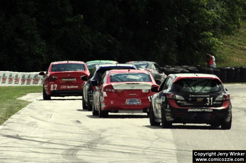 Jayson Clunie / Pierre Kleinubing Mazda Speed 3 trails the lead pack of ST cars into turn 7