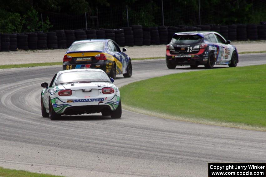Andrew Carbonell / Rhett O'Doski Mazda MX-5 chases two other ST cars