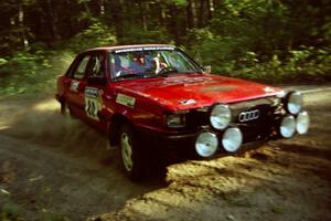 Jon Kemp / Rod Hendricksen Audi 4000 Quattro at a 90-right on SS1, Akeley Cutoff.