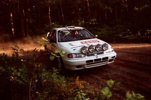 Dean Panton / Michael Fennell Hyundai Elantra at a 90-right on SS1, Akeley Cutoff.