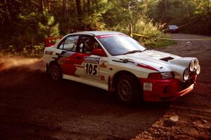 Bill Morton / Mike Busalacchi Mitsubishi Lancer Evo IV at a 90-right on SS1, Akeley Cutoff.