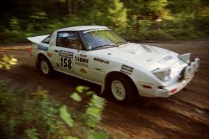 Ted Grzelak / Chris Plante Mazda RX-7 at a 90-right on SS1, Akeley Cutoff.