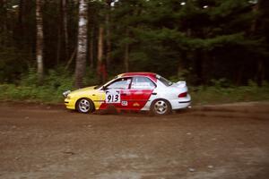 Janusz Jastrzebski / Kathy Freund Subaru Impreza at speed on SS1, Akeley Cutoff.