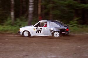 Jim Buchwitz / C.O. Rudstrom Ford Escort at speed on SS1, Akeley Cutoff.