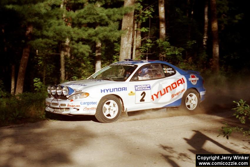 Noel Lawler / Charles Bradley Hyundai Tiburon at a 90-right on SS1, Akeley Cutoff.