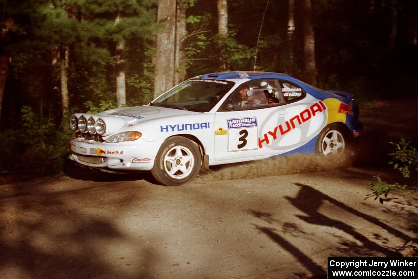 Paul Choiniere / Jeff Becker Hyundai Tiburon at a 90-right on SS1, Akeley Cutoff.