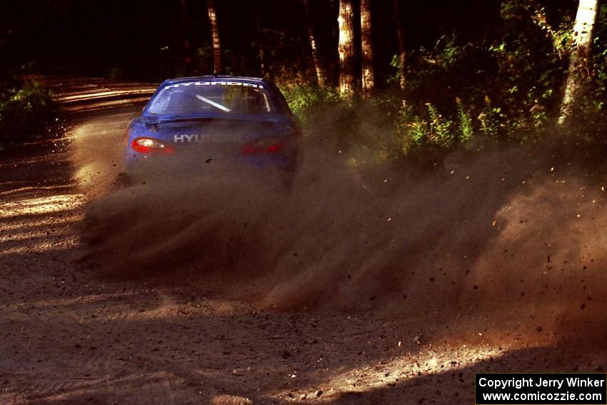 Paul Choiniere / Jeff Becker Hyundai Tiburon powers out of a 90-right on SS1, Akeley Cutoff.