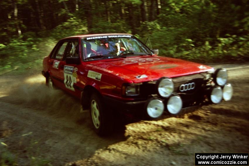 Jon Kemp / Rod Hendricksen Audi 4000 Quattro at a 90-right on SS1, Akeley Cutoff.