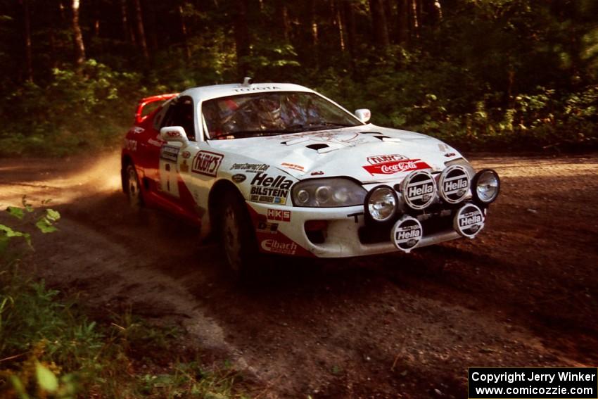 Ralph Kosmides / Joe Noyes Toyota Supra Turbo at a 90-right on SS1, Akeley Cutoff.