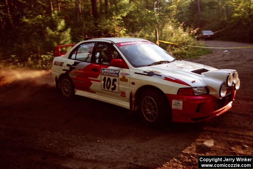 Bill Morton / Mike Busalacchi Mitsubishi Lancer Evo IV at a 90-right on SS1, Akeley Cutoff.