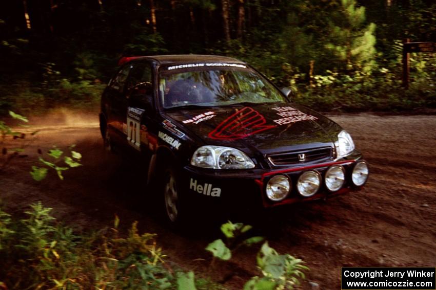 Bryan Hourt / Brian Shanfeld Honda Civic at a 90-right on SS1, Akeley Cutoff.